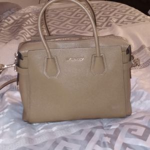 Michael Kors purse was carried 3 times, too big for me! It's a kacki tan color